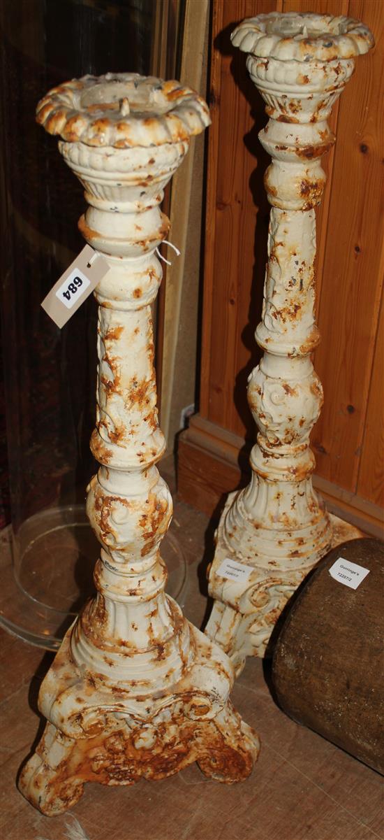 A pair of cut down metal altar sticks